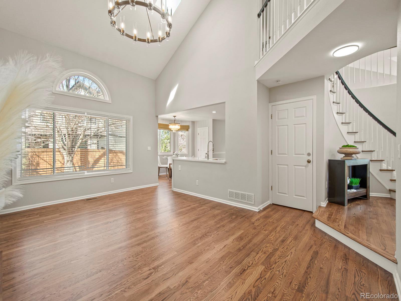 9358 Cornell Circle Highlands Ranch, CO 80130 - Photo 24 of 50 an empty room with wooden floor fan and windows