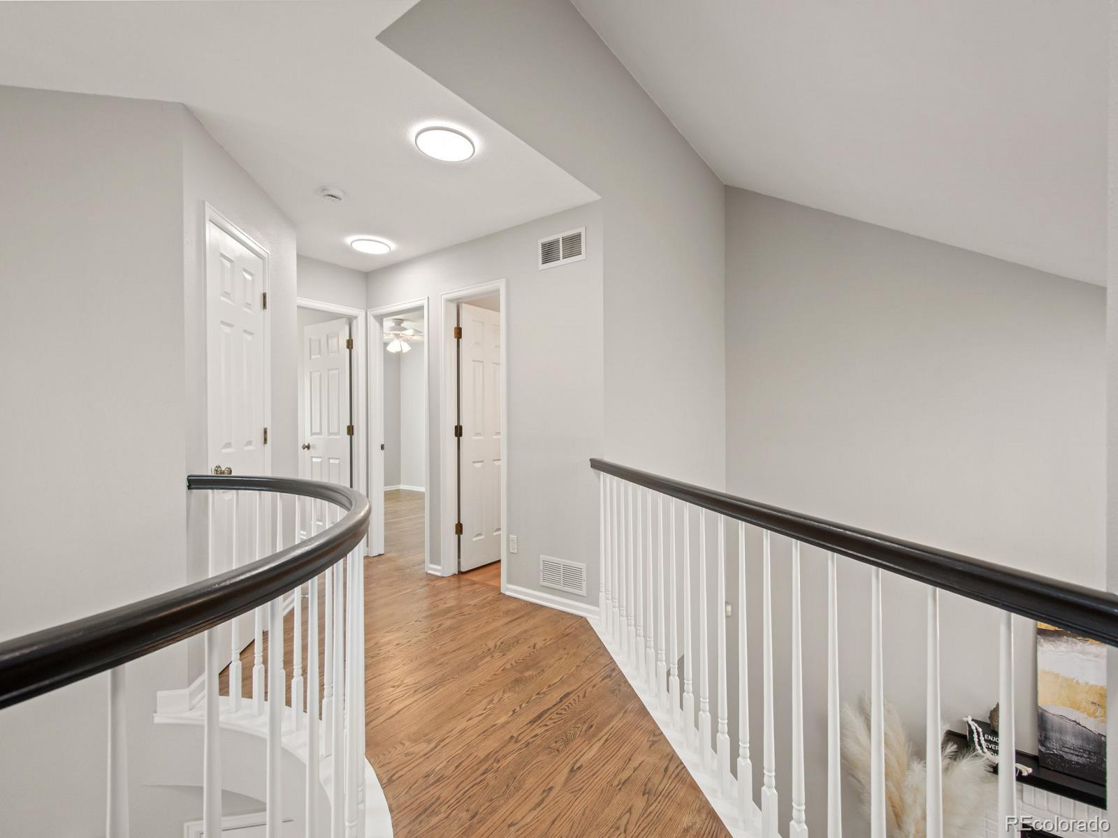 9358 Cornell Circle Highlands Ranch, CO 80130 - Photo 26 of 50 a view of a hallway with a staircase