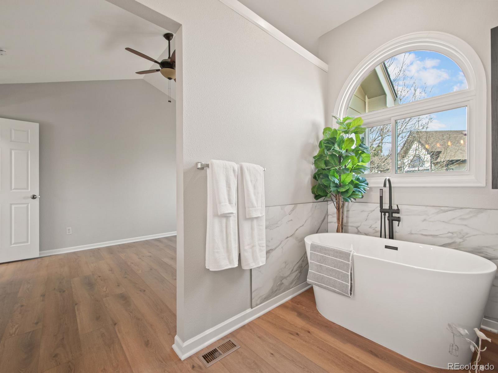 9358 Cornell Circle Highlands Ranch, CO 80130 - Photo 32 of 50 a white bath tub sitting next to a white tub