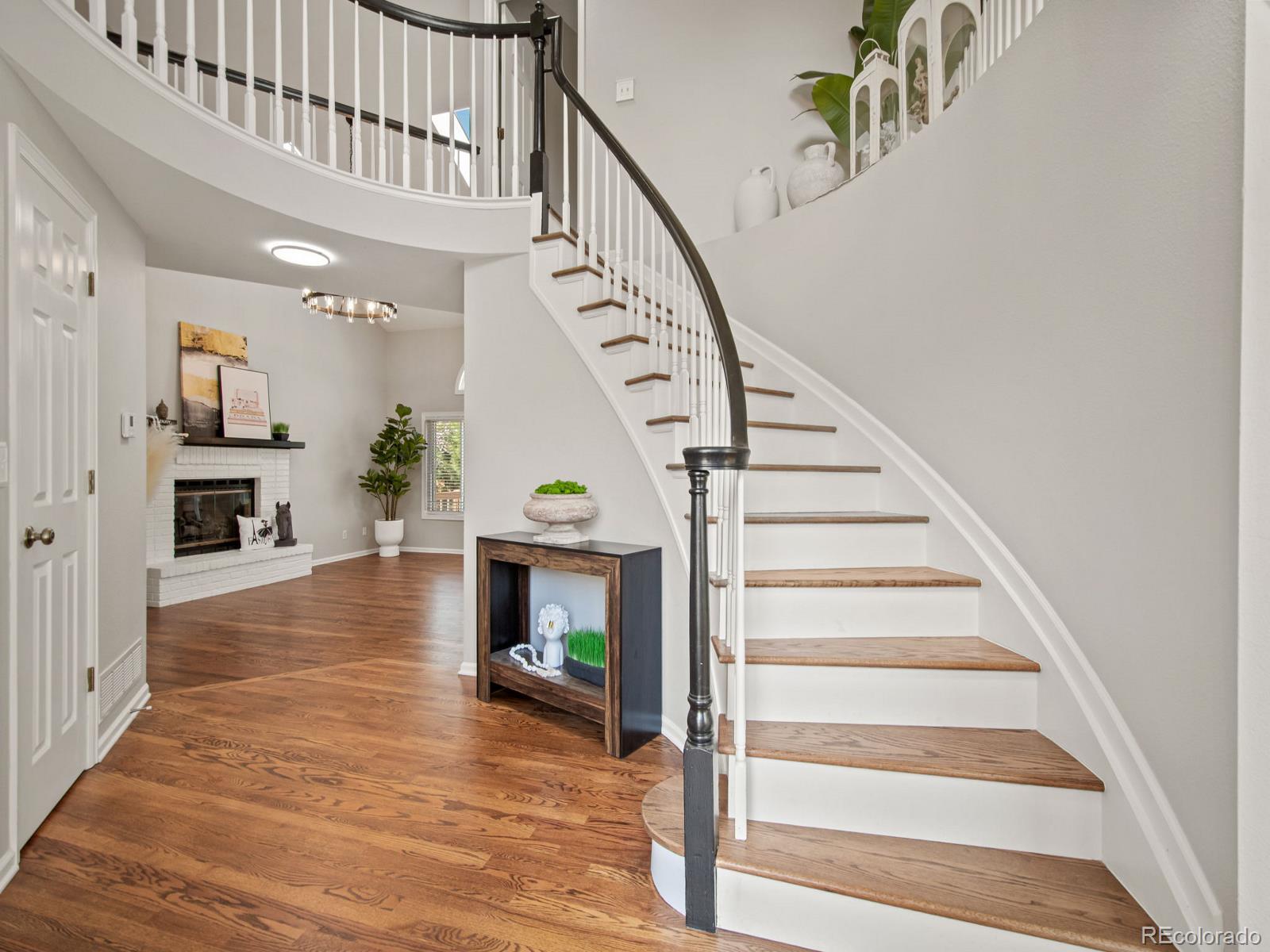 9358 Cornell Circle Highlands Ranch, CO 80130 - Photo 4 of 50 a view of entryway and hall with wooden floor