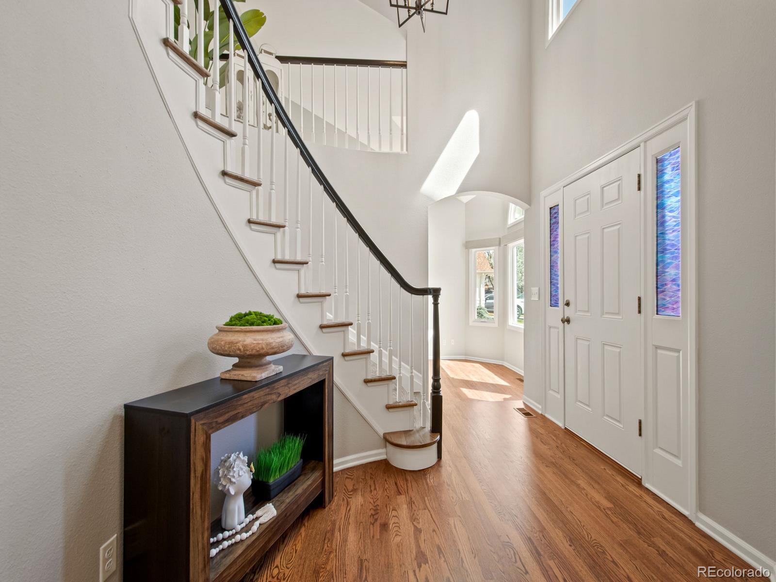 9358 Cornell Circle Highlands Ranch, CO 80130 - Photo 5 of 50 a living room with furniture and a fireplace