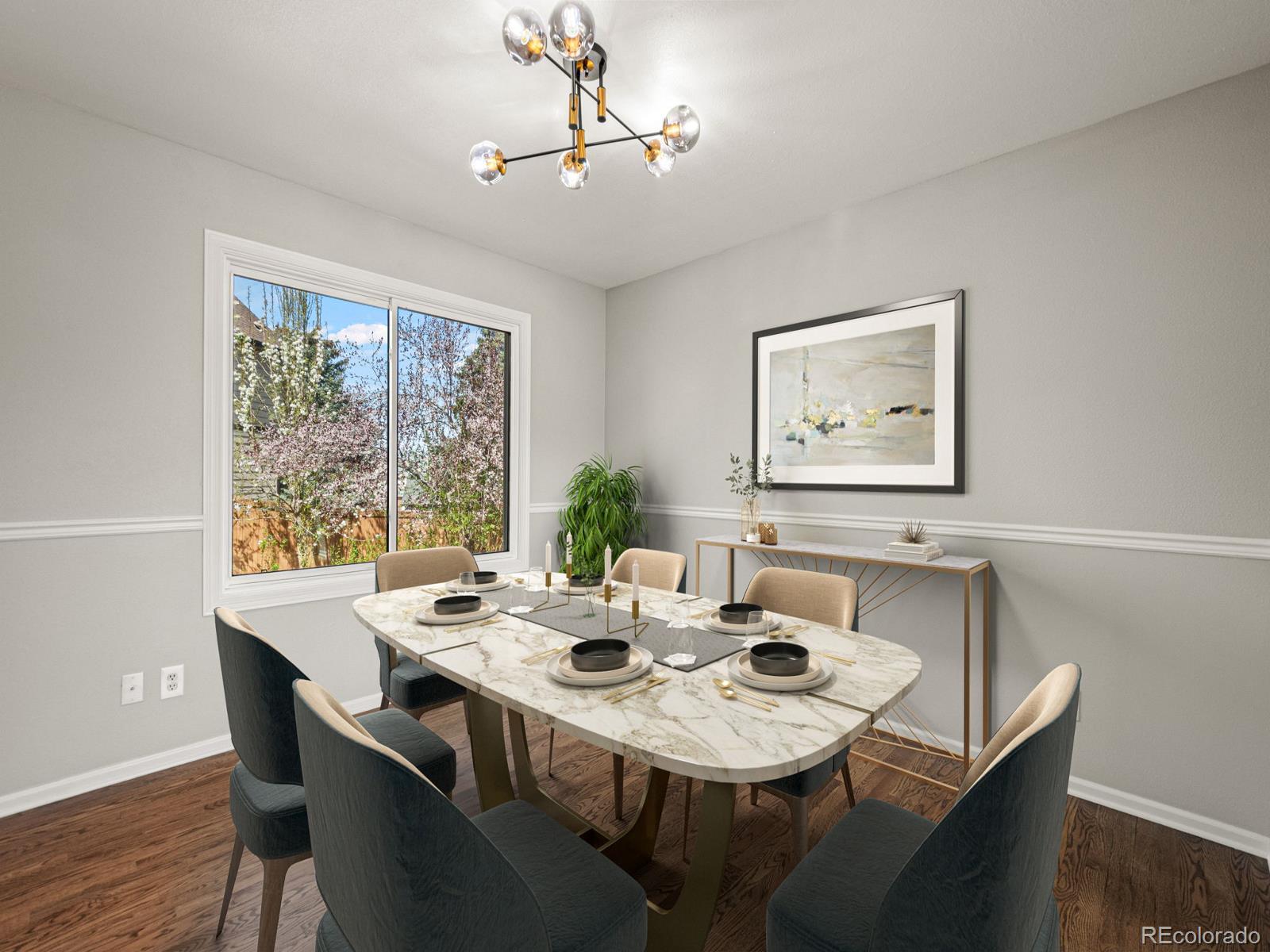 9358 Cornell Circle Highlands Ranch, CO 80130 - Photo 7 of 50 a view of a dining room with furniture window and wooden floor
