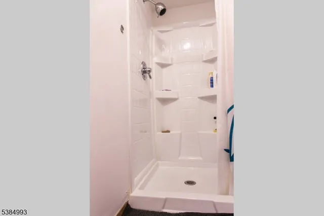 a bathroom with a glass shower door
