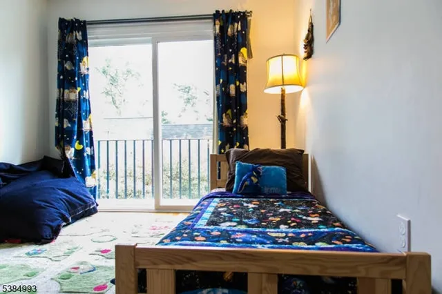 a bed room with a bed and a window