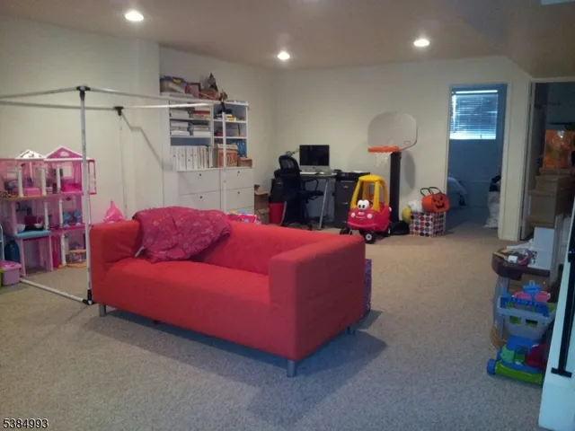 a room with furniture and a flat screen tv