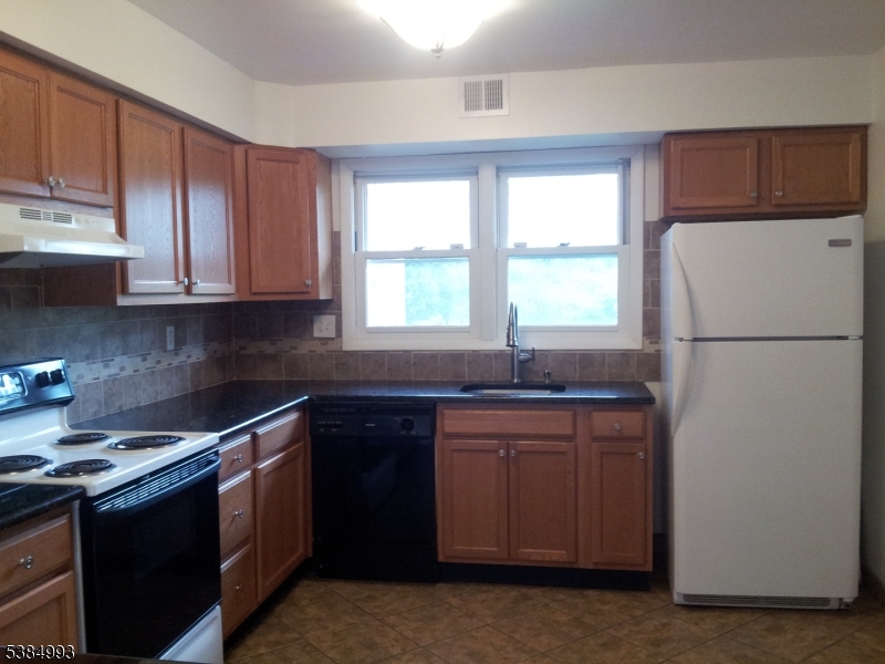 1 Carriage Way, Unit 12 Montclair, NJ 07042 - Photo 3 of 19 a kitchen with a sink stove and refrigerator