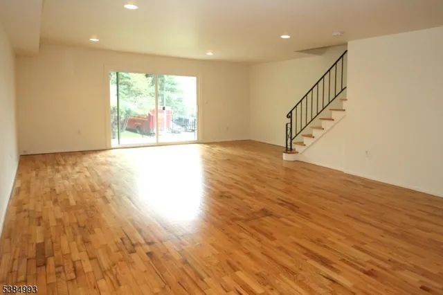 a view of an entryway with wooden floor