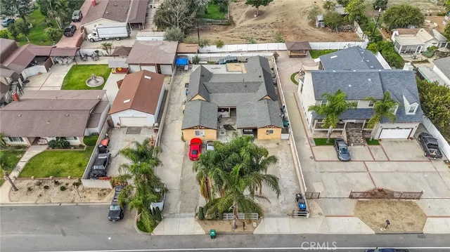 an aerial view of residential houses with outdoor space