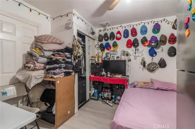 a view of a room with lots of stuff and white walls