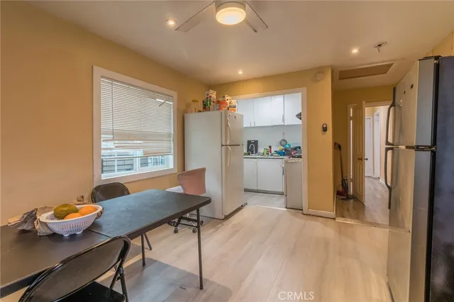 a kitchen that has a table and chairs in it