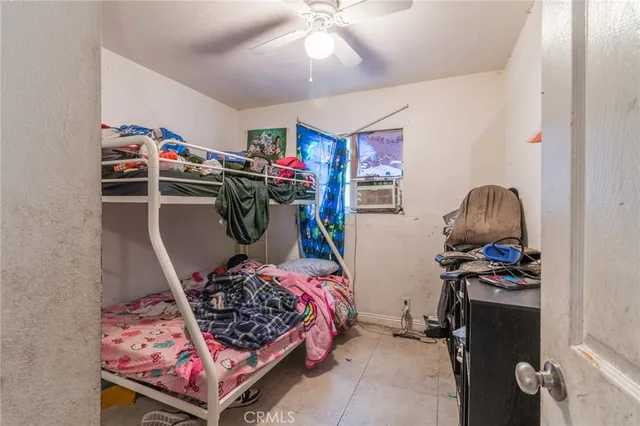 a bed room with a bed and a window