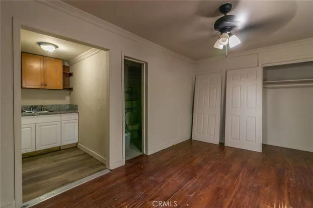 a view of a kitchen cabinets and wooden floor