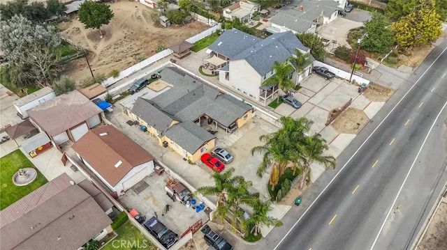 an aerial view of a house with outdoor space
