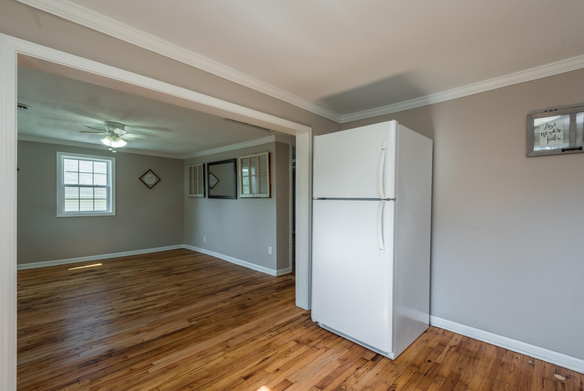 1460 Center Street Alcoa, TN 37701 - Photo 11 of 23 a view of an empty room with wooden floor and a window