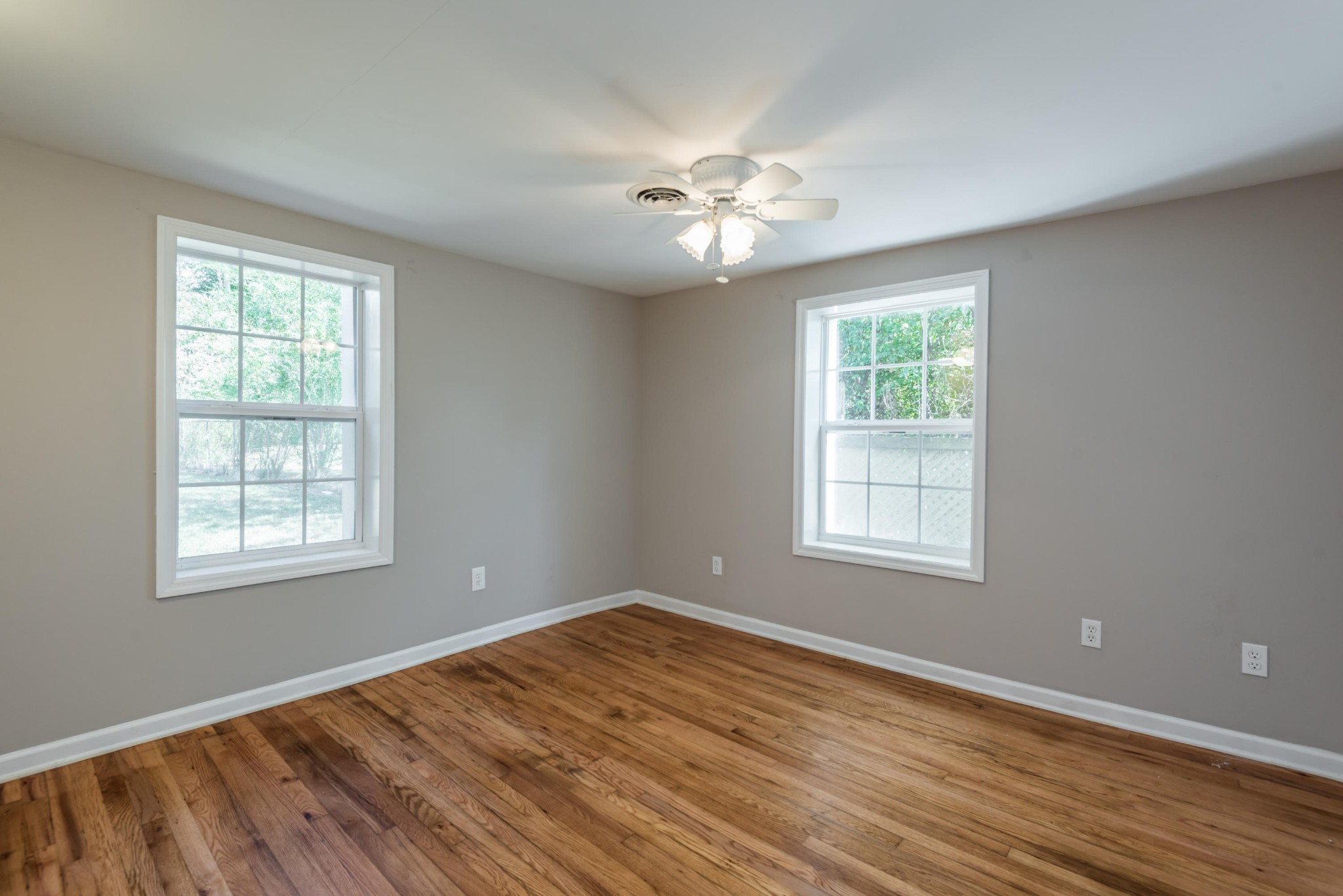 1460 Center Street Alcoa, TN 37701 - Photo 14 of 23 a view of an empty room with wooden floor and a window