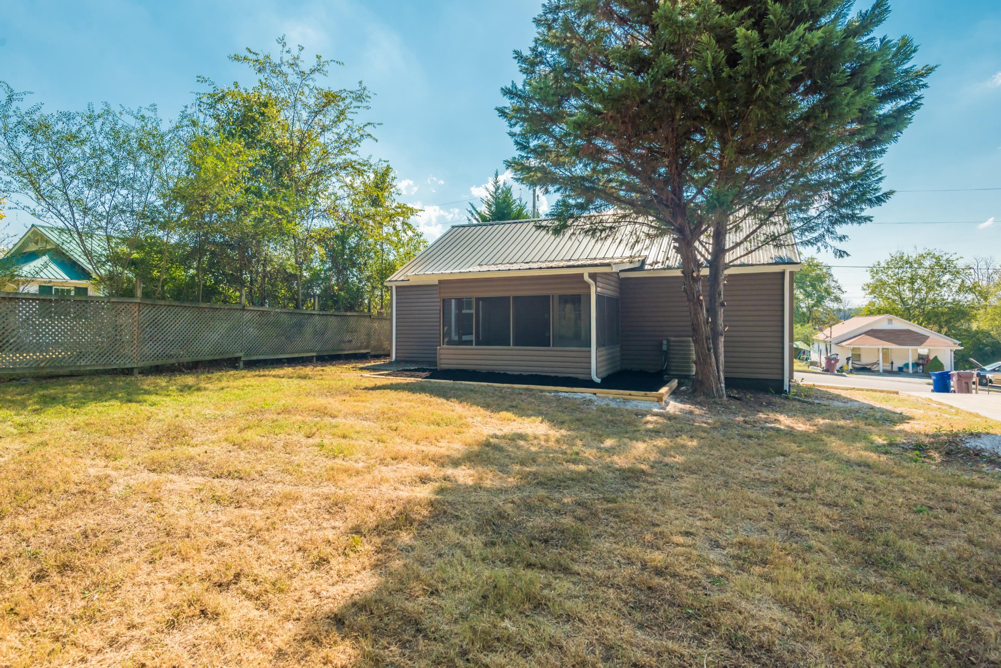 1460 Center Street Alcoa, TN 37701 - Photo 22 of 23 a front view of a house with a yard and garage