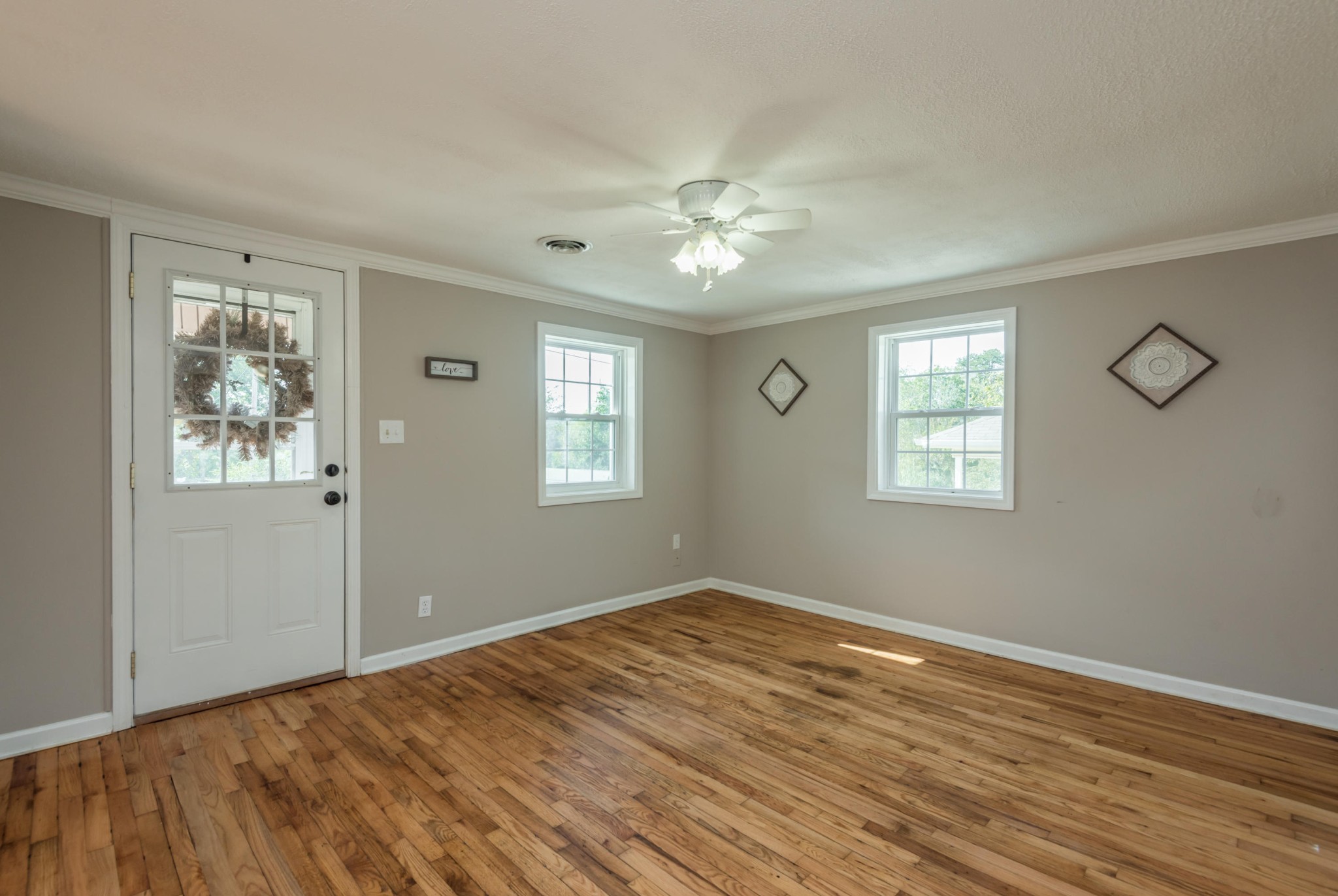 1460 Center Street Alcoa, TN 37701 - Photo 4 of 23 a view of empty room with wooden floor and fan