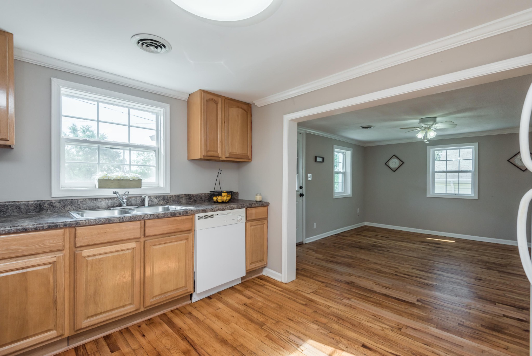 1460 Center Street Alcoa, TN 37701 - Photo 10 of 23 a kitchen with granite countertop white cabinets and white appliances