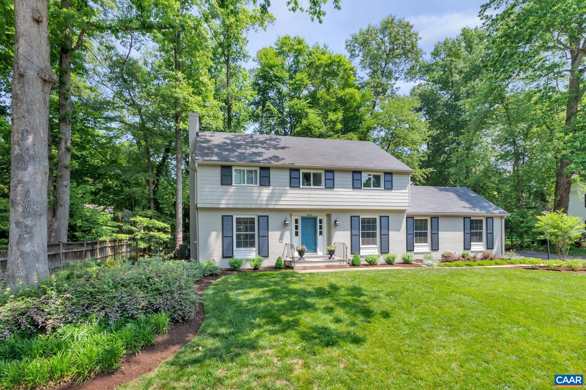 1445 Grove Road Charlottesville, VA 22901 - Photo 1 of 61 a front view of a house with a yard table and chairs