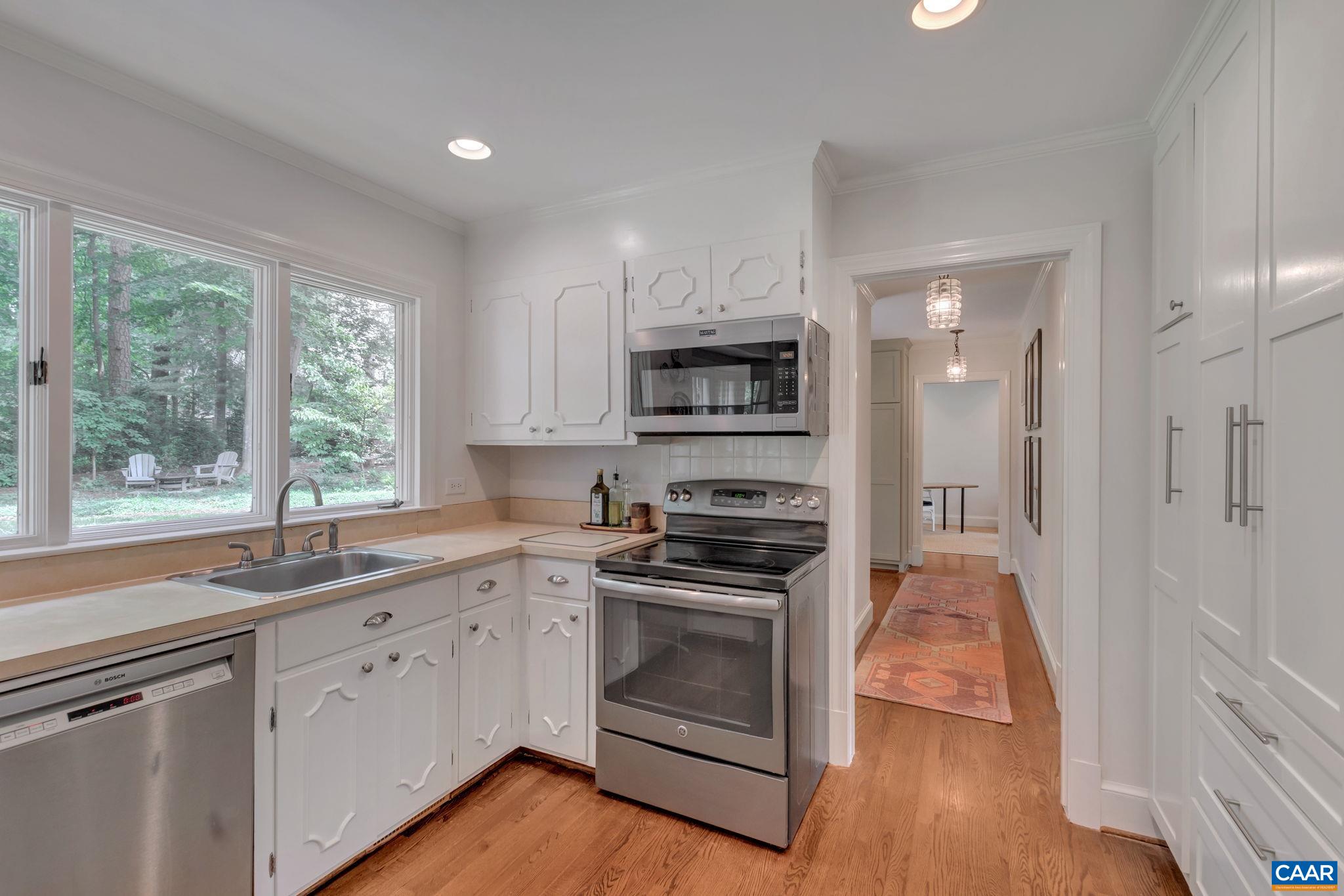 1445 Grove Road Charlottesville, VA 22901 - Photo 15 of 61 a kitchen with a sink stove top oven and refrigerator