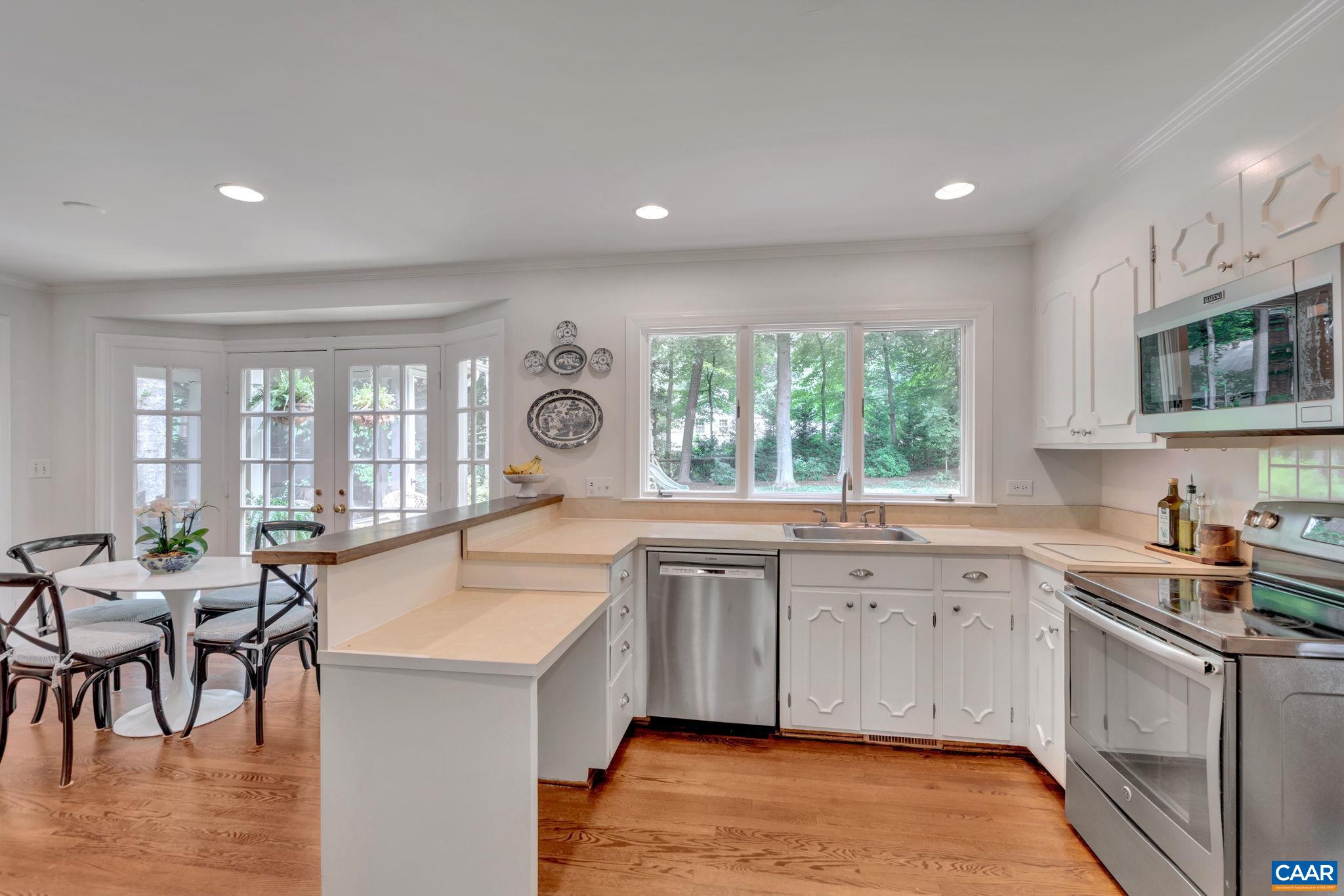 1445 Grove Road Charlottesville, VA 22901 - Photo 16 of 61 a kitchen with a sink stove and cabinets