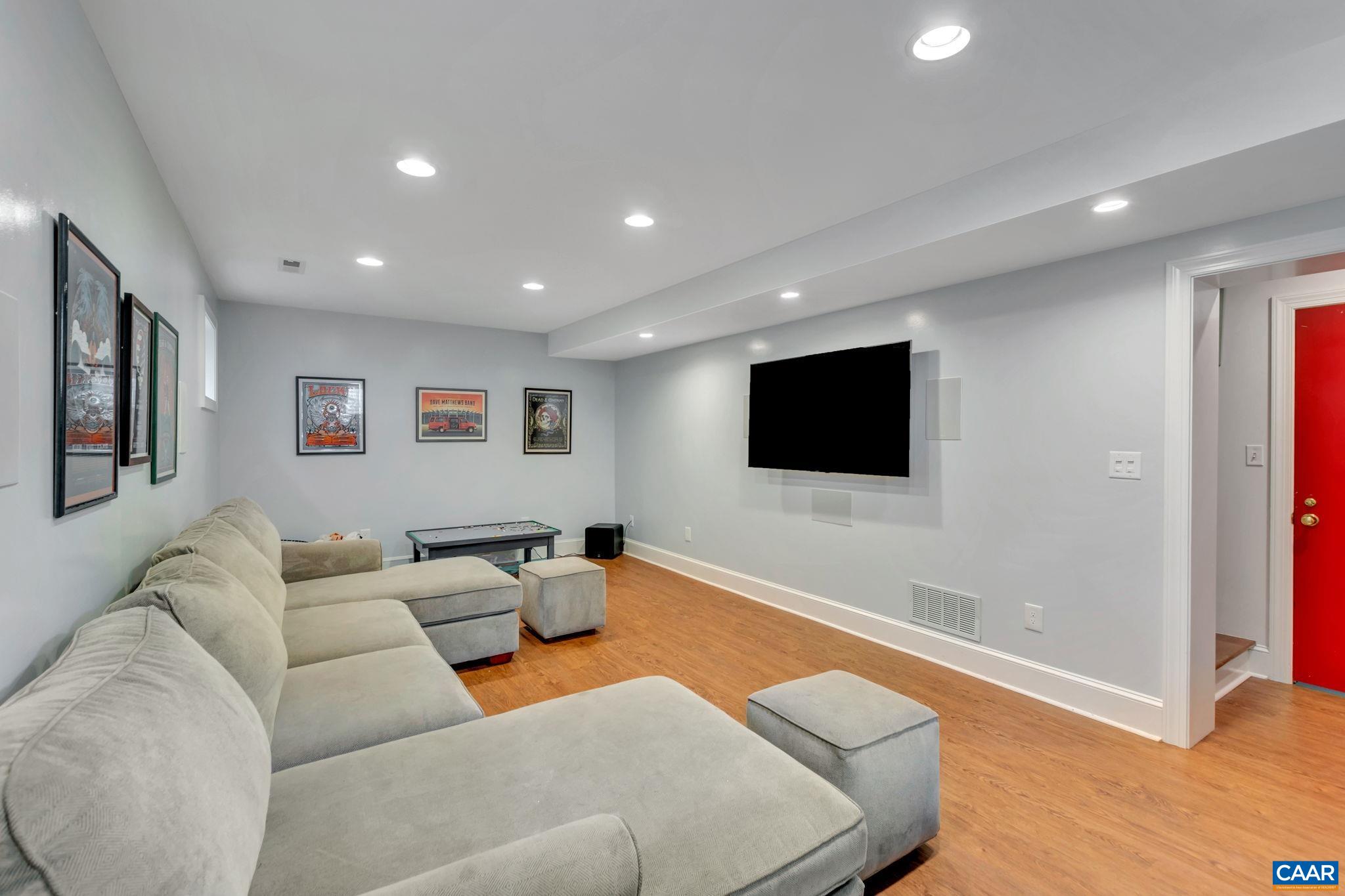 1445 Grove Road Charlottesville, VA 22901 - Photo 42 of 61 a living room with furniture and a flat screen tv
