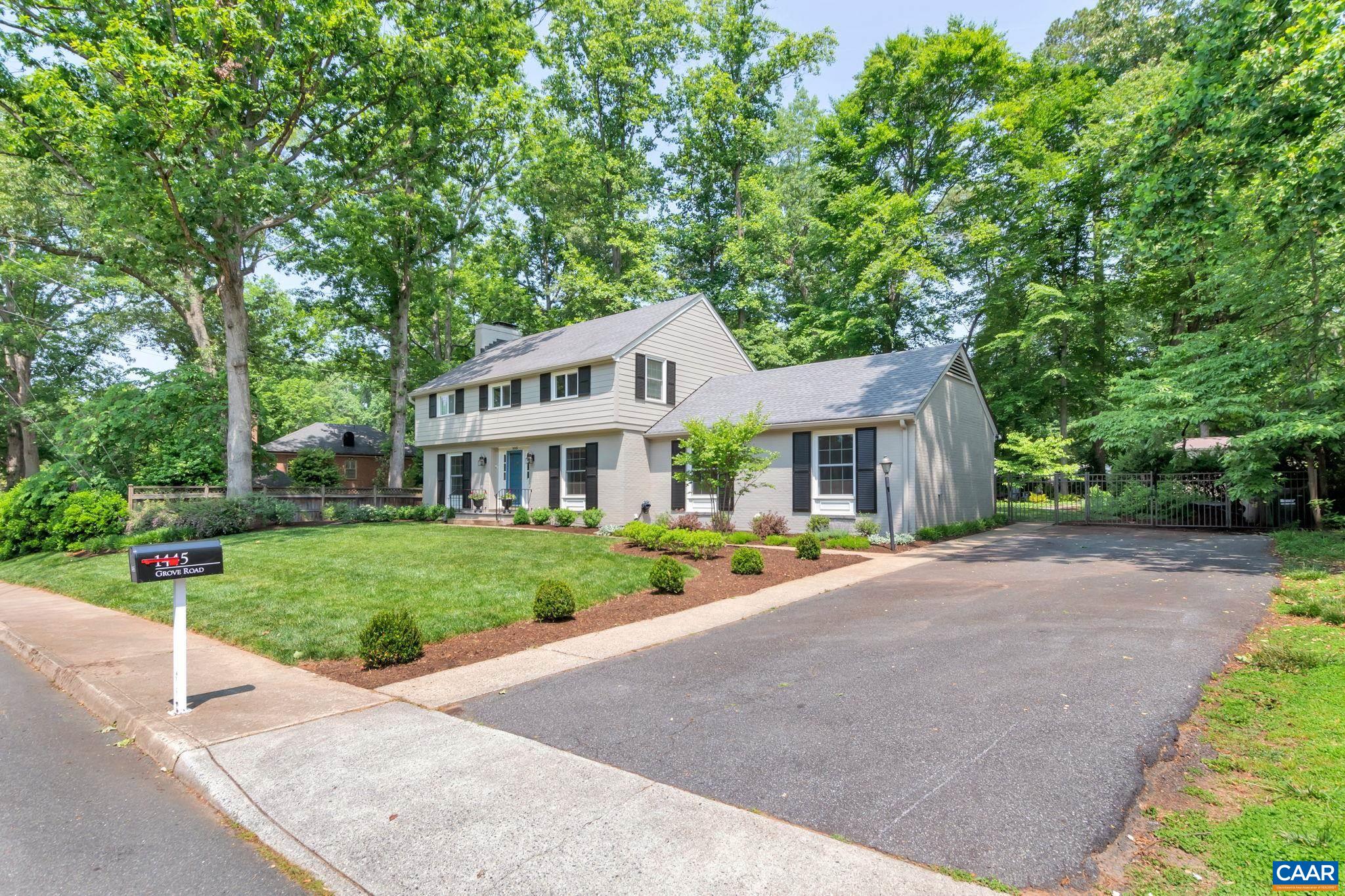 1445 Grove Road Charlottesville, VA 22901 - Photo 61 of 61 a front view of a house with a yard and trees