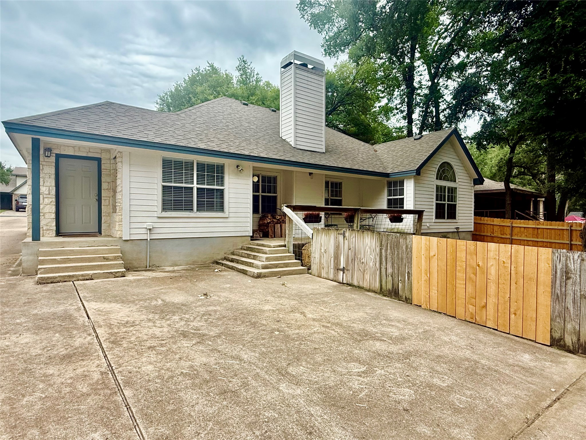 1127 Robin Road Elgin, TX 78621 - Photo 16 of 19 Rear view of property featuring a chimney and a shingled roof