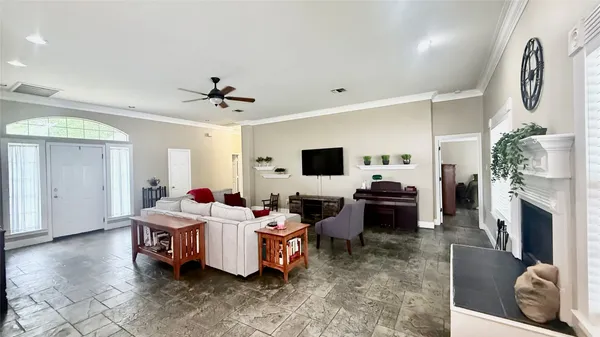 a living room with furniture and a fireplace