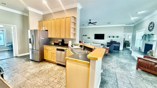 a front view of a house with a garden and yard