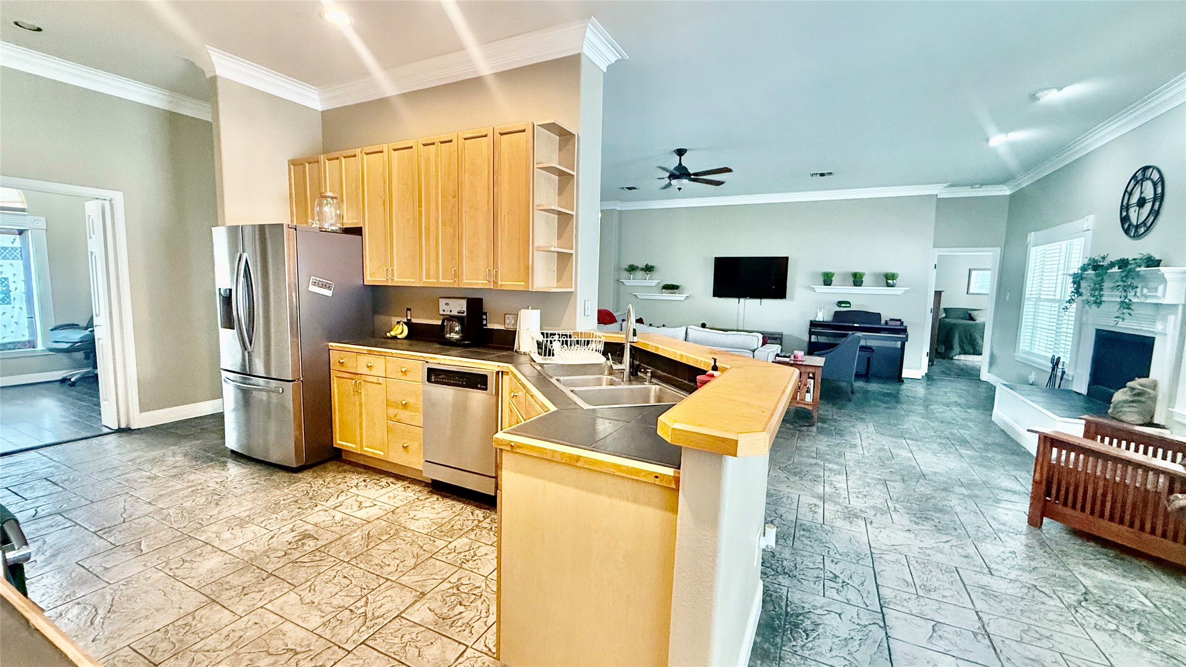 1127 Robin Road Elgin, TX 78621 - Photo 19 of 19 Kitchen featuring appliances with stainless steel finishes, light brown cabinets, a peninsula, a sink, and open floor plan