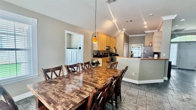 a kitchen with stainless steel appliances granite countertop a sink a stove and a microwave