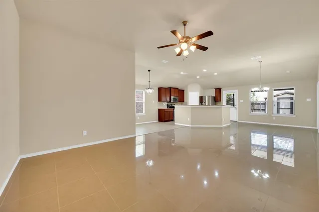a view of a kitchen with a sink and a stove top oven