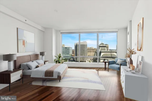 a view of a room with wooden floor