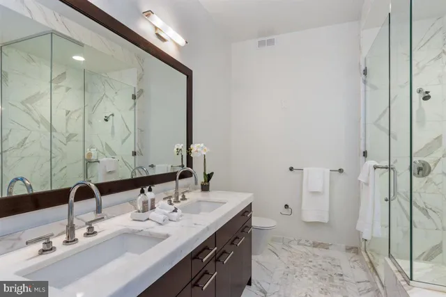 a view of a room with wooden floor and a window