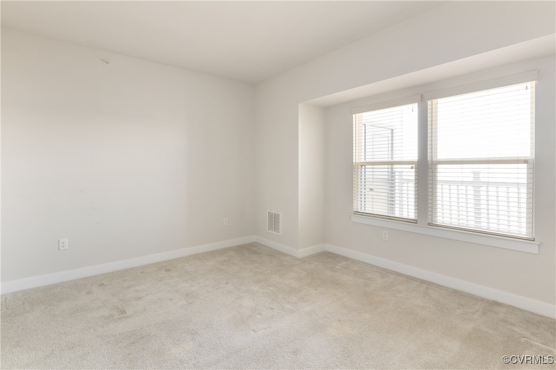 3700 Maze Runner Drive, Unit 405 Midlothian, VA 23112 - Photo 16 of 28 an empty room with a window