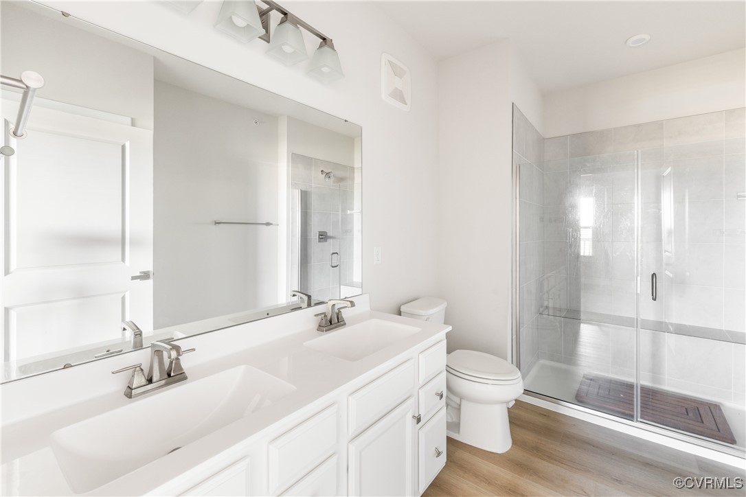 3700 Maze Runner Drive, Unit 405 Midlothian, VA 23112 - Photo 20 of 28 a bathroom with a sink a toilet and shower