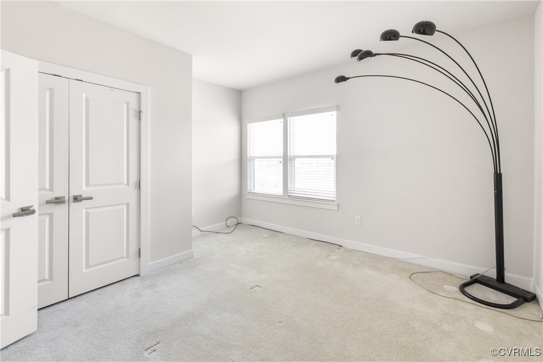 3700 Maze Runner Drive, Unit 405 Midlothian, VA 23112 - Photo 5 of 28 an empty room with a window