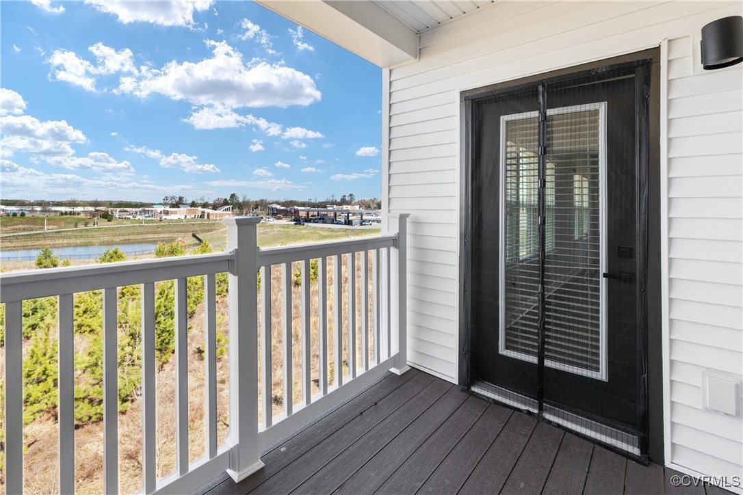 3700 Maze Runner Drive, Unit 405 Midlothian, VA 23112 - Photo 8 of 28 a view of a balcony with wooden floor & fence