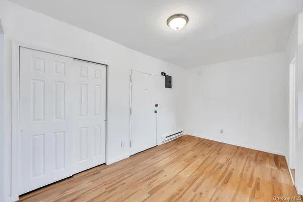 an empty room with wooden floor