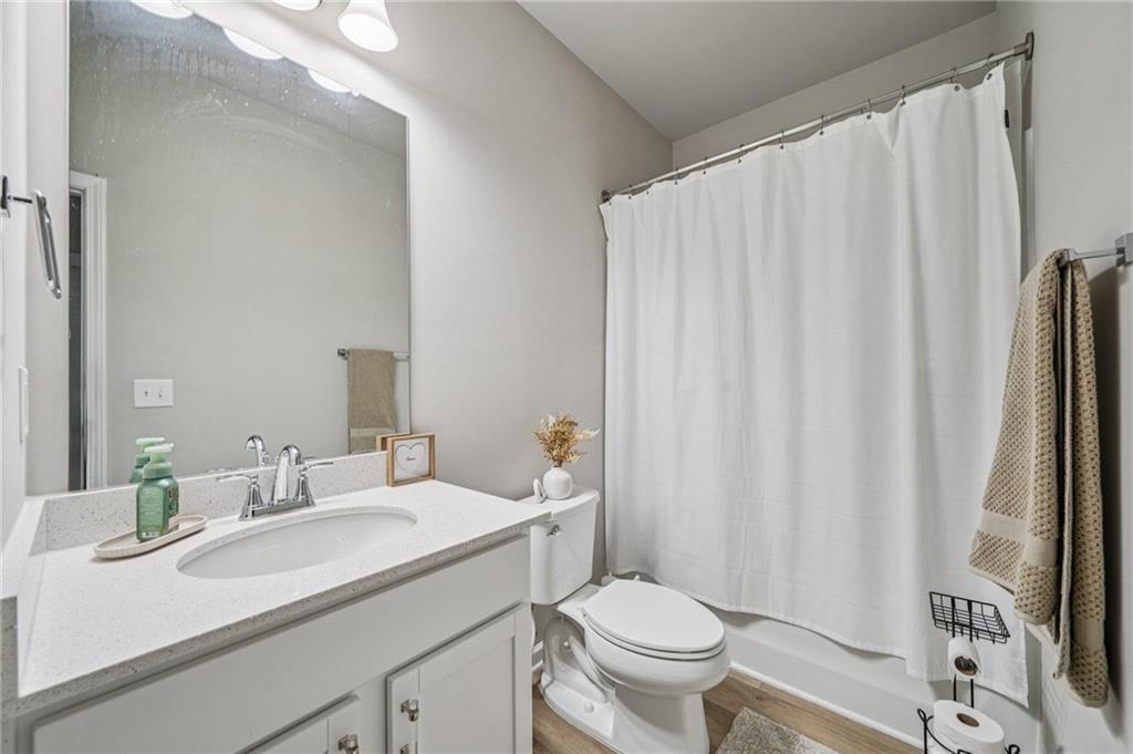 120 Cabin Way Hampton, GA 30228 - Photo 19 of 51 a bathroom with a sink a toilet and a mirror