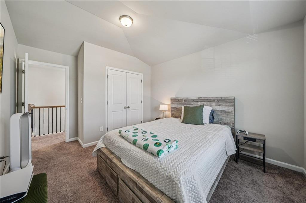 120 Cabin Way Hampton, GA 30228 - Photo 22 of 51 a bedroom with a bed and a table