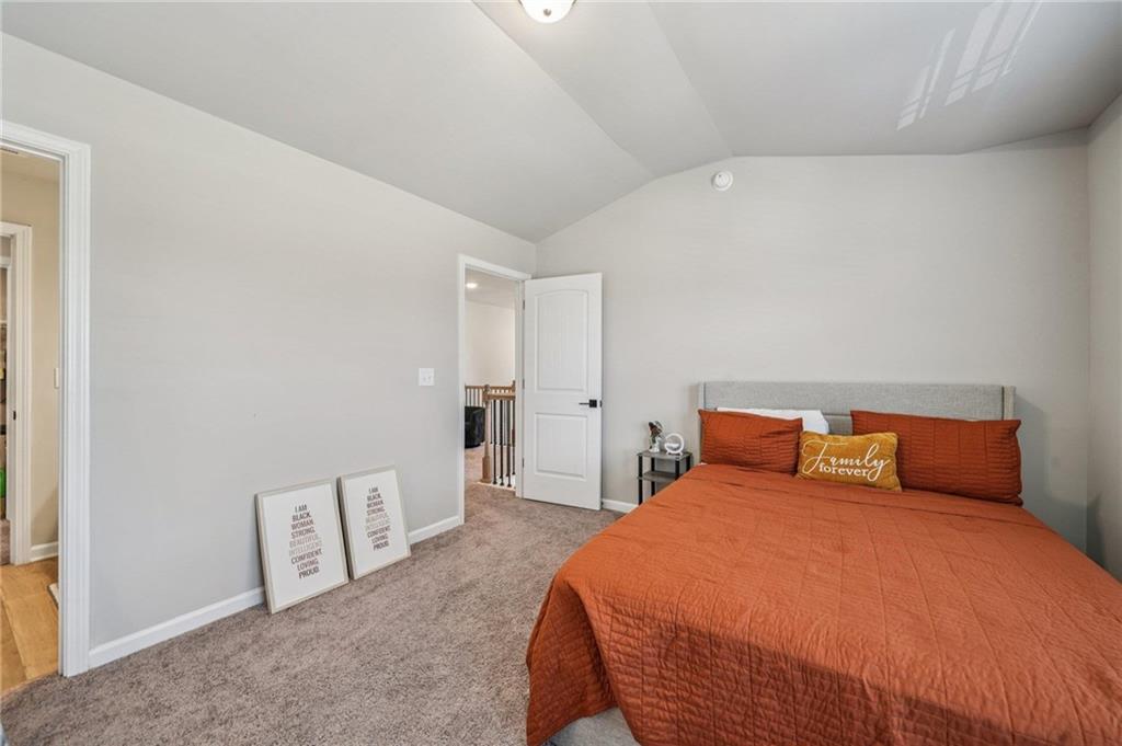 120 Cabin Way Hampton, GA 30228 - Photo 27 of 51 a bedroom with a bed and painting on the wall