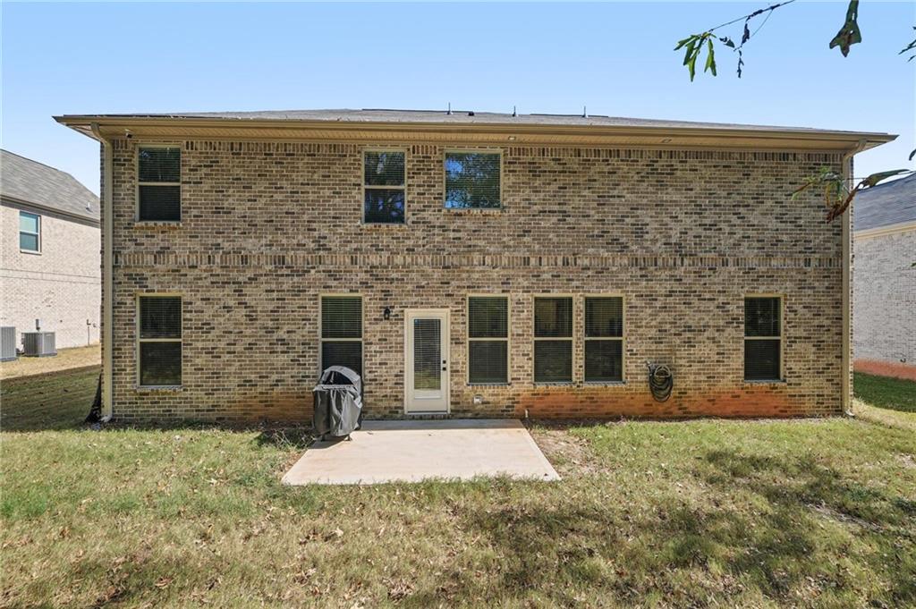 120 Cabin Way Hampton, GA 30228 - Photo 34 of 51 a front view of a house with a yard