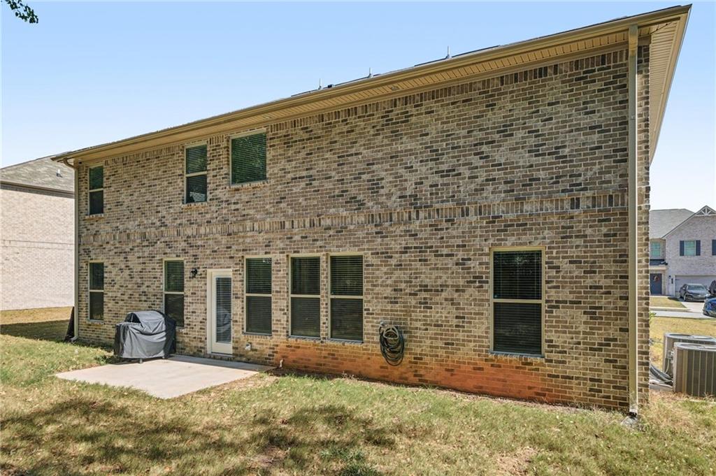 120 Cabin Way Hampton, GA 30228 - Photo 36 of 51 a brick building with a large windows