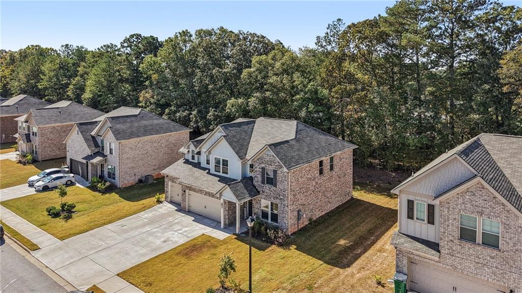 120 Cabin Way Hampton, GA 30228 - Photo 40 of 51 aerial view of a house with large trees