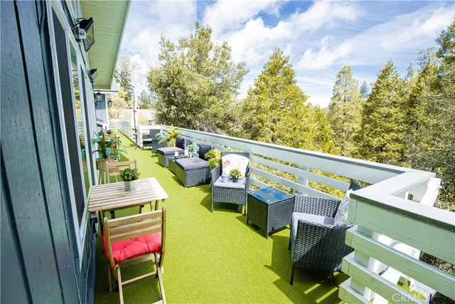 a view of a house with pool and chairs