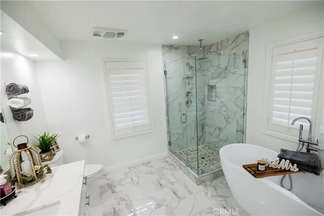 a bed room with a bed and a television