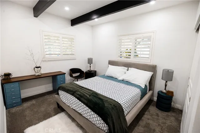 a view of a livingroom with furniture and a flat screen tv