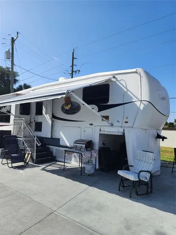 a view of a patio with table and chairs with wooden floor